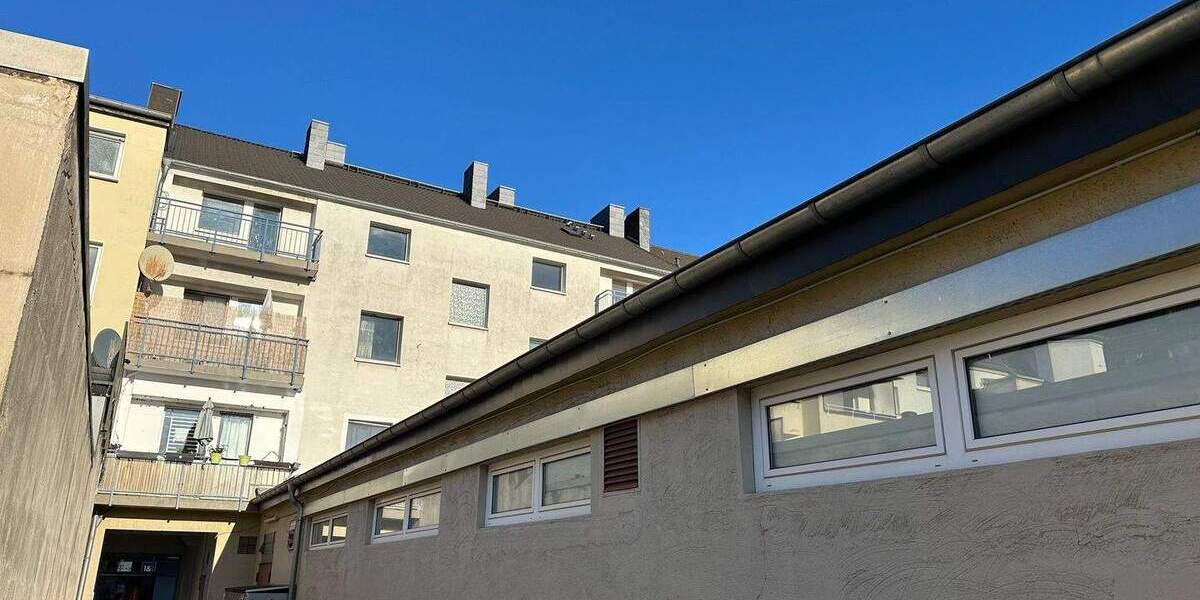 Bestlage Fußgängerzone: Ertragstarkes Wohn-Geschäftshaus mit solventem Ankermieter, 6 Wohneinheiten und 9 Garagen 1 zimmer